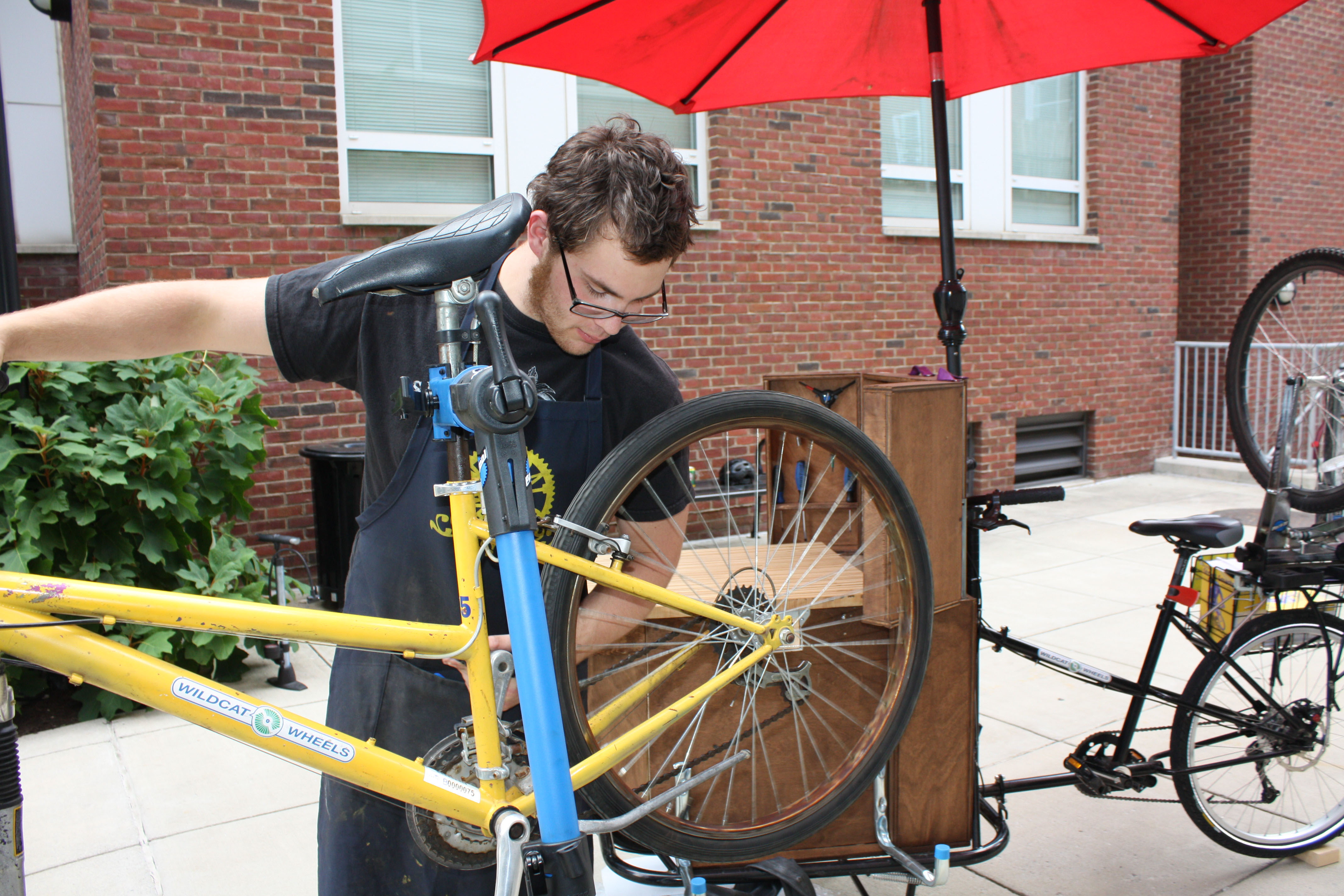 Student fixing a bicycle